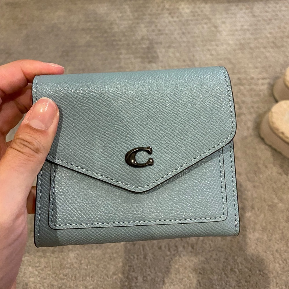 Coach wallet, never used (back pocket still has original cardboard). Blue/gray